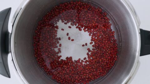 Adzuki beans in a pressure cooker with water, salt and baking soda.