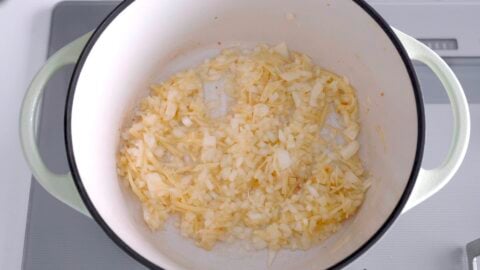 Sautéing onions and ginger for Arroz Caldo Recipe