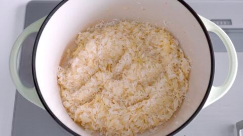 Rice added to pot and sautéed with onions and ginger.