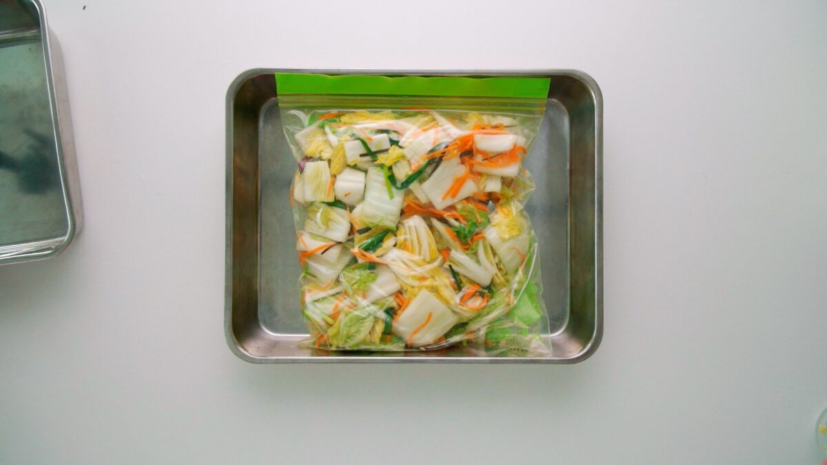 Japanese cabbage pickles in a zipper bag on a tray.