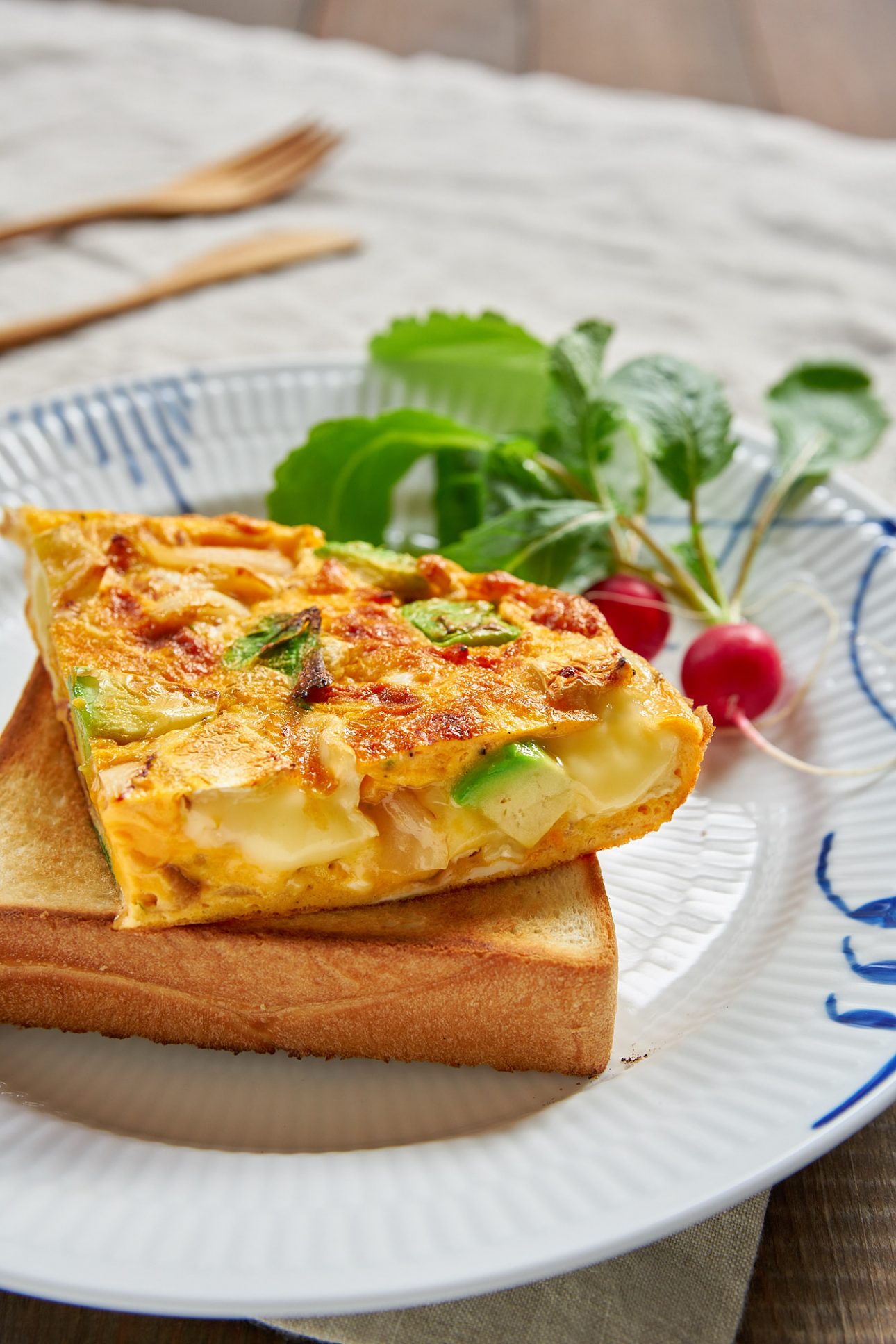 Pools of molten camembert cheese make this 15 minute avocado and caramelized onion frittata ridiculously good.