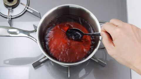 Udon broth boiling in a pot.