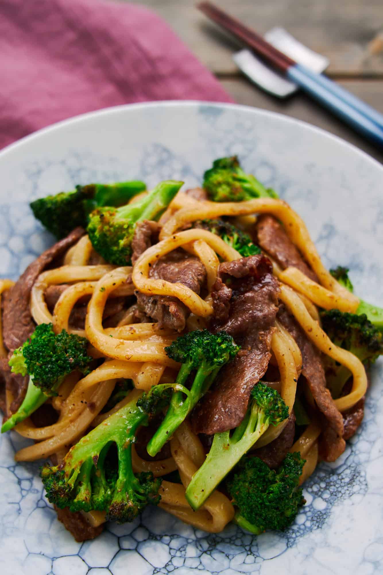 This plate of beef yaki udon features thick savory udon noodles stir-fried with tender beef and crunchy broccoli.