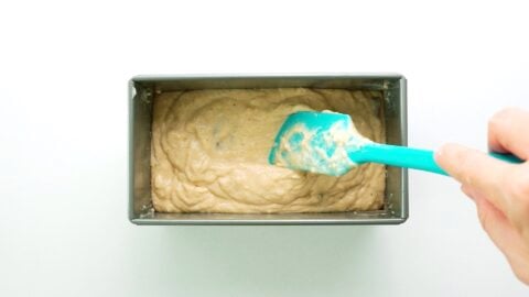 Banana bread batter in a loaf pan.