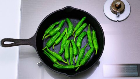 Grilling Shishito Peppers on the stove.