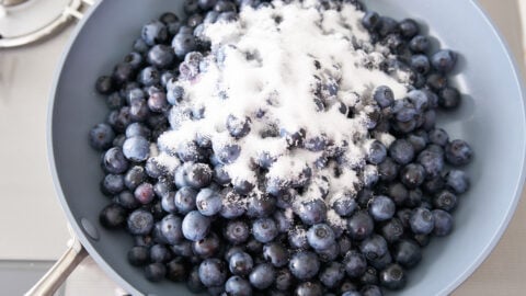 Fresh blueberries in a pan with sugar for making blueberry filling