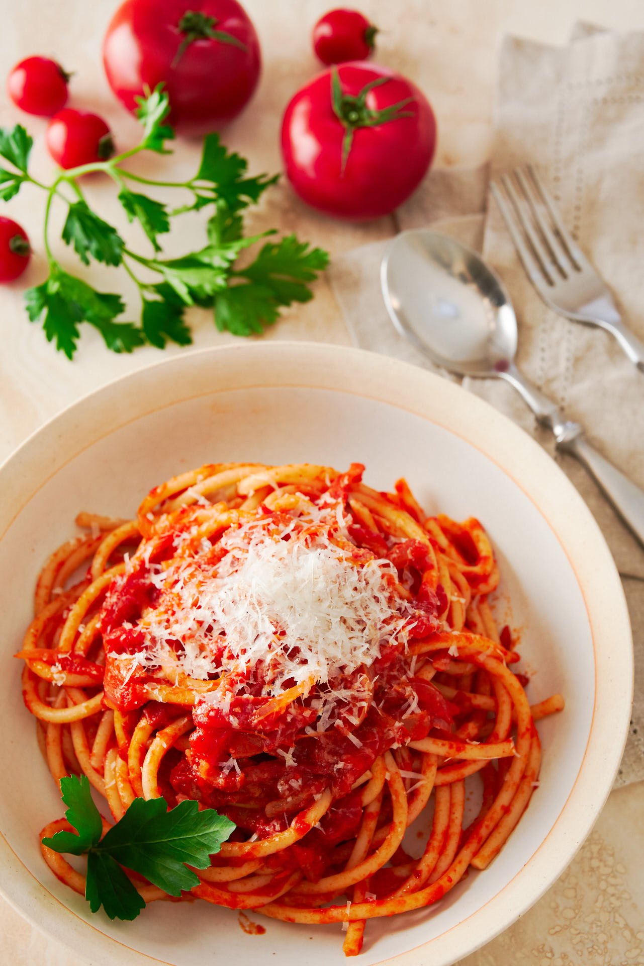 Bucatini All'Amatriciana is a mouthwateringly delicious pasta from Amatrice that comes together from just a handful of ingredients in a matter of minutes.