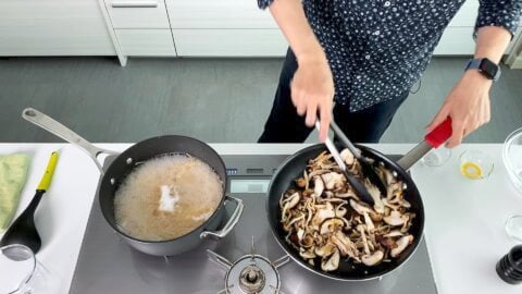 Stir-frying mixed Japanese mushrooms.