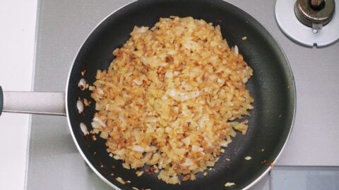 Onions browned in the pan the steak was fried in.