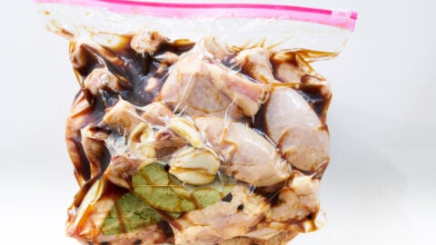 Marinate the chicken in soy sauce, vinegar, garlic, bay leaves, black pepper and coconut sugar overnight.