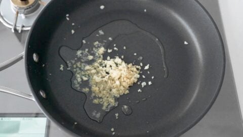 Ginger and garlic sautéing in oil for making fried noodles.