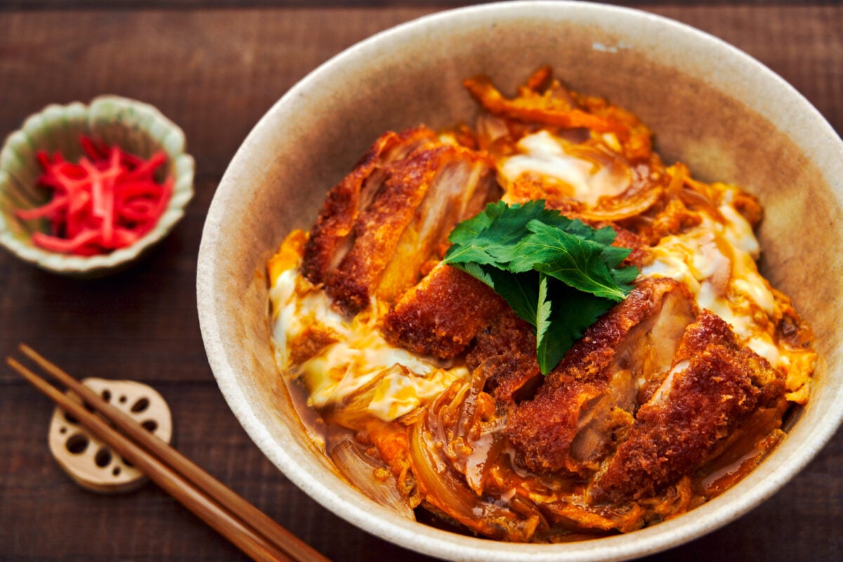 Chicken Katsudon is a mouthwatering rice bowl covered with a juicy chicken cutlet simmered with onions and egg in a savory-sweet broth.