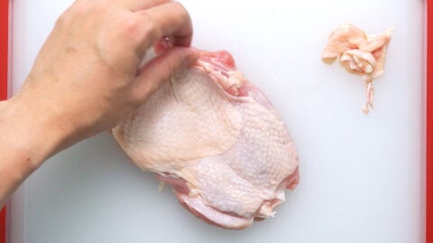 Trimming chicken legs for making Chicken Nanban.