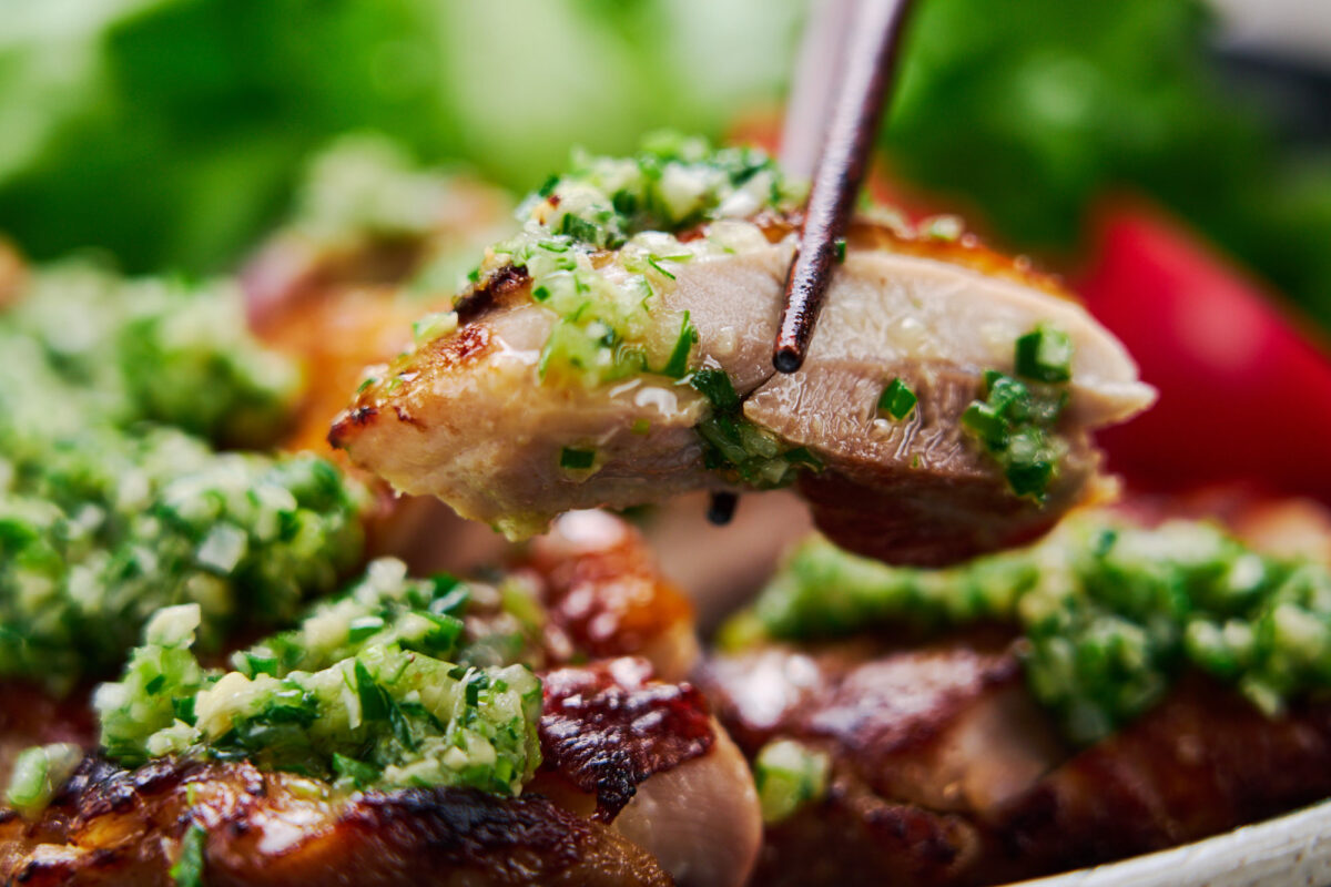 Juicy slice of pan-fried chicken thigh with fragrant ginger scallion oil.