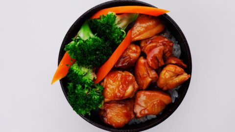 Chicken teriyaki bowl with broccoli and carrots.