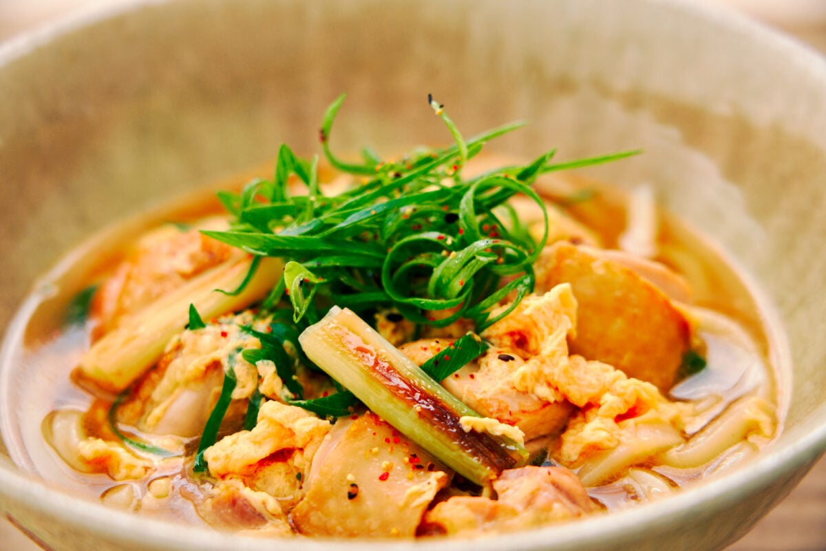 Chicken egg and caramelized scallion udon noodle soup.