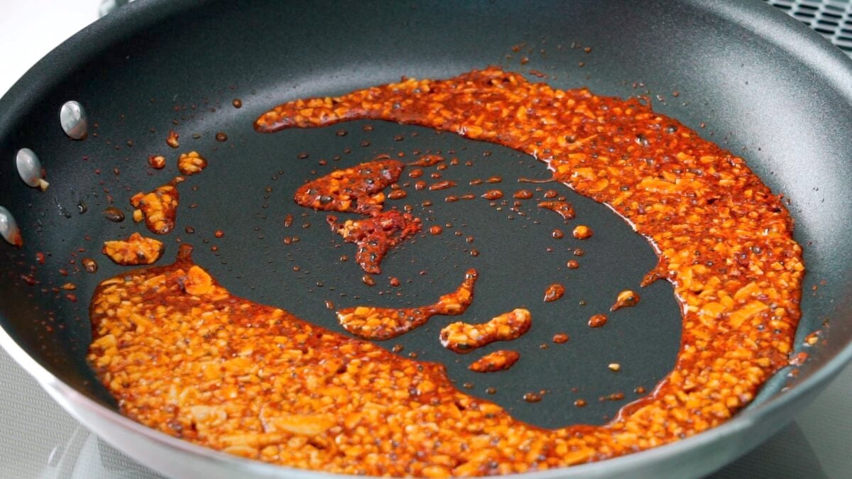 Garlic and chili flakes frying in olive oil.