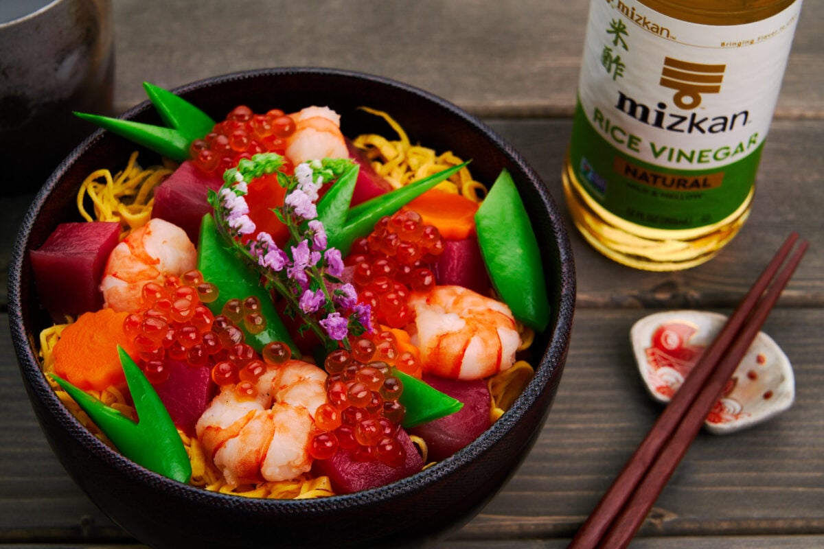 How to make Chirashi Sushi with tuna, shrimp, egg, carrots and snap peas.