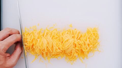 Golden threads of egg or kinshi tamago for topping chirashi sushi.