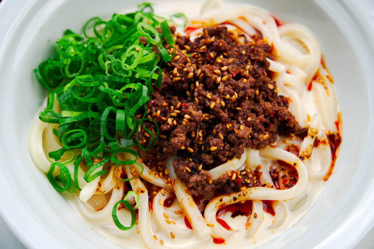 Cold nutty sesame broth with thick udon noodles and a spicy topping of beef and chili oil makes for the perfect summer meal.