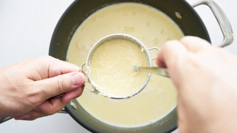 Straining pureed corn potage removes the skins from the corn resulting in a velvety smooth soup.