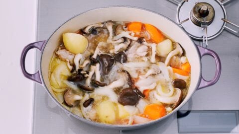 Simmering mushrooms and vegetables for Japanese cream stew.