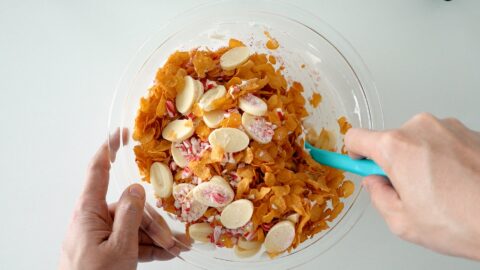 Add the cornflakes, crushed candy cane and white chocolate to the marshmallow mixture and stir.