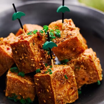 Ultra-crispy on the outside and tender and juicy on the inside these Crispy Tofu Bites are glazed with a savory sweet sauce that's loaded with ginger, garlic and black pepper. The perfect plant-based appetier.