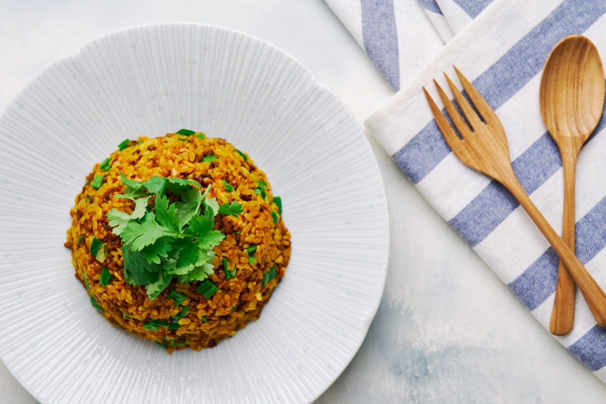 Easy Japanese curry fried rice recipe with ground beef, caramelized onions, and Japanese curry powder.