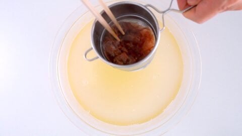 Straining the solids out of dashi stock.