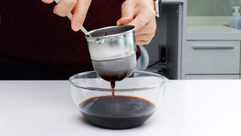 Straining Japanese dashi soy sauce.