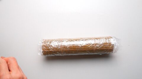 Datemaki rolled in bamboo matt wrapped in plastic.