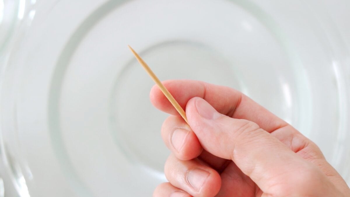 Toothpick in hand for deveining shrimp.