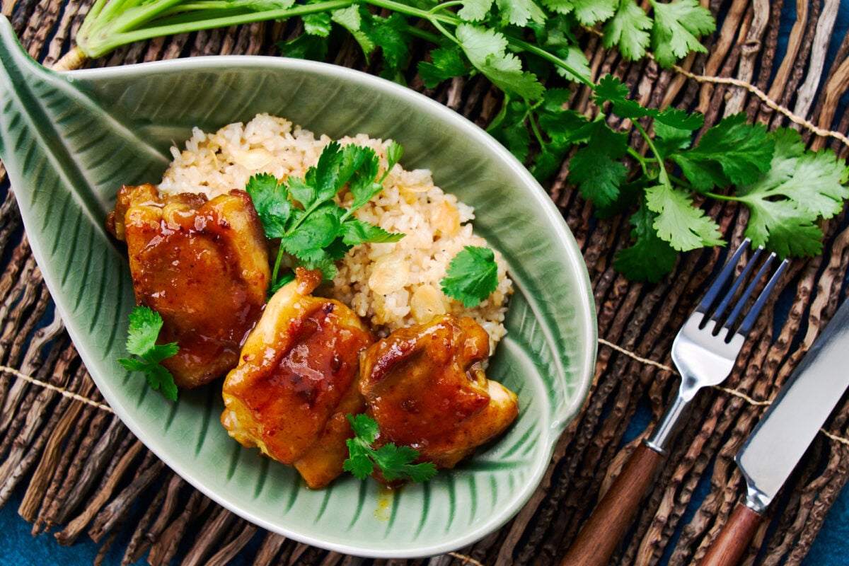 These easy curried chicken thighs are glazed in sweet and sticky mango chutney and come together in about 15 minutes.