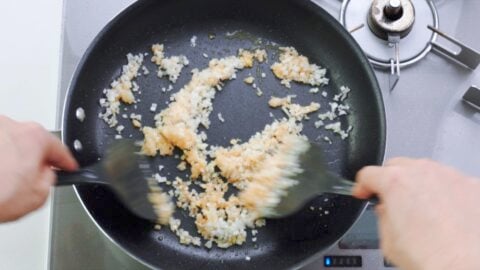 Stir-frying ginger, garlic and scallions for Chili Shrimp.