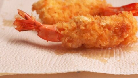 Ebi Fry or Panko fried shrimp draining on paper towels after being fried.