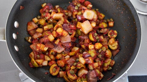 Caramelizing the tomato paste brings out the sweetness of the tomatoes in this Caponata.