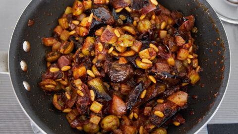 The best eggplant Caponata, with creamy eggplant, crisp celery, sweet raisins and briny olives, all in a sweet and sour tomato sauce.