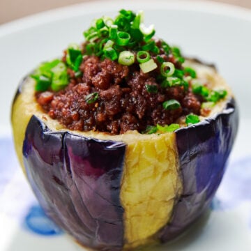 Caramelized miso and meat get stuff into a tender, creamy eggplant cup to make this Japanese Nasu Dengaku.