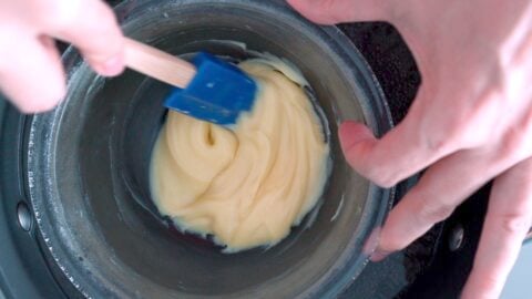 Melting white chocolate over a double boiler.