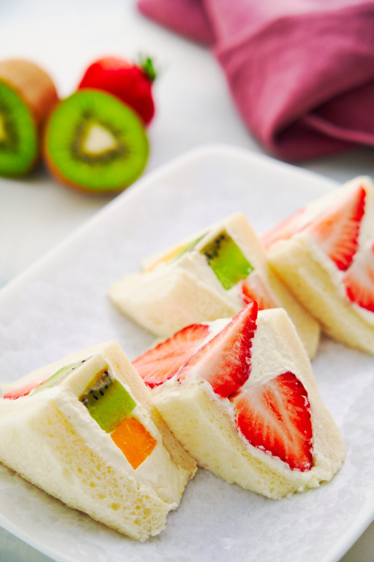 Loaded with ripe fruit and vanilla-infused cream, fruit sandwiches are an easy snack or casual dessert that comes together in minutes.