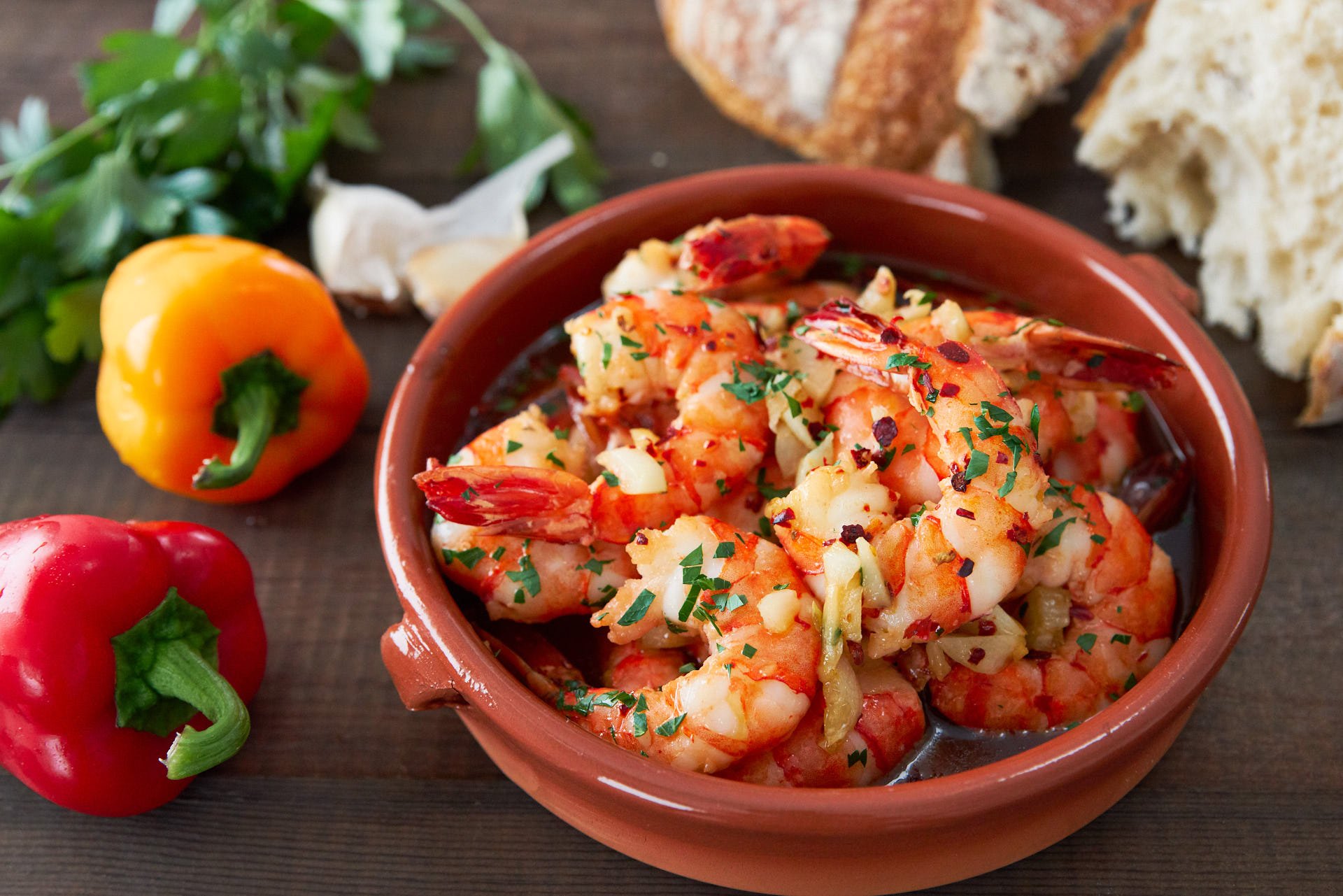 Savory and delicious, Spanish Garlic Shrimp (Gambas al Ajillo) is an easy appetizer that comes together in minutes. Crusty bread is a must, to dip in the irresistable garlic shrimp oil.