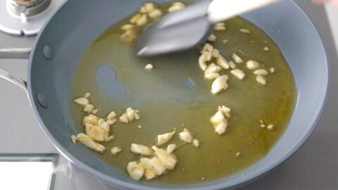 Sautéing garlic in olive oil to make Spanish Garlic Shrimp