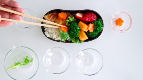 Flowers cut from carrots are added to the Bento.