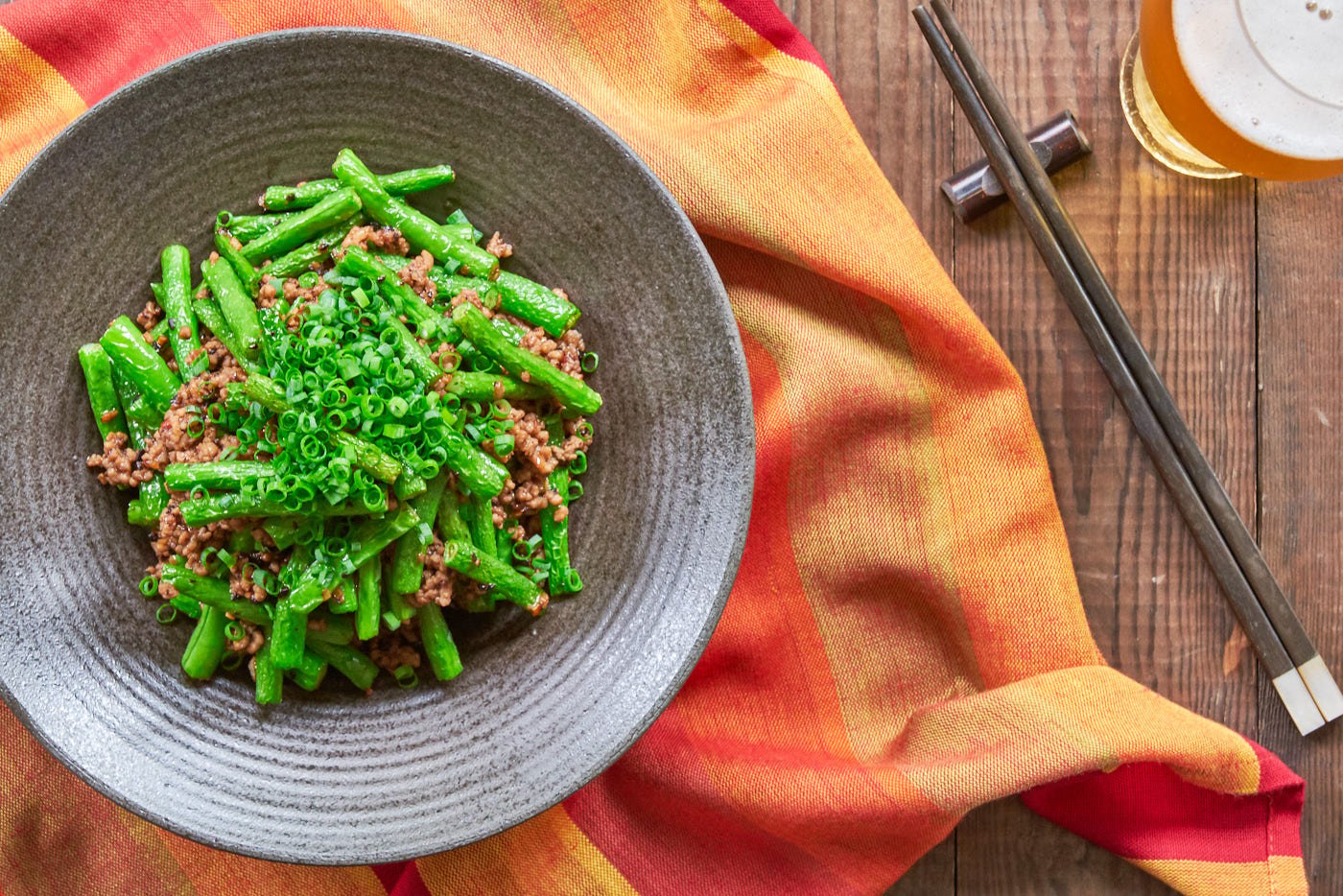 With tender vivid green green beans stir-fried with pork and a chili garlic black bean sauce, this easy delicious stir-fry comes together in just minutes.