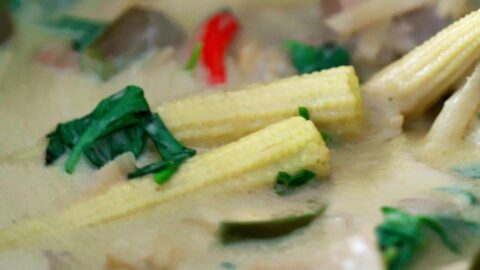 Adding Thai Basil at the end of cooking for authentic green curry.