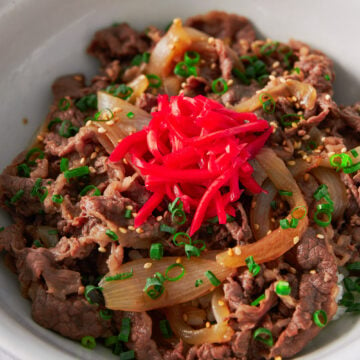 Gyudon (Beef and Bowl), is a classic Japanese dish made with beef and onions that have been simmered in a sweet and savory broth. Served over rice, this easy, satisfying meal comes together in under 15 minutes.