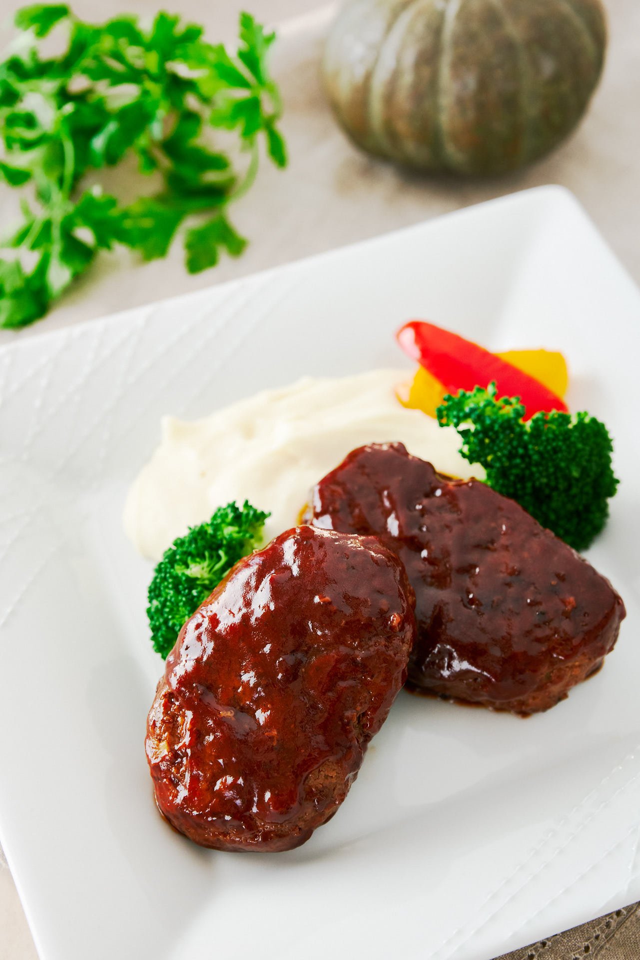 Hamburg Steak is like a single serving meatloaf. With big juicy patties glazed in a sweet and savory sauce, this is one of the most popular home cooked meals in Japan.