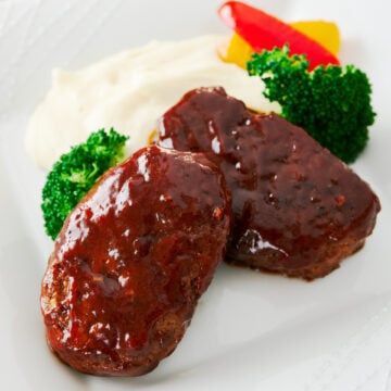 Hamburg Steak is like a single serving meatloaf. With big juicy patties glazed in a sweet and savory sauce, this is one of the most popular home cooked meals in Japan.