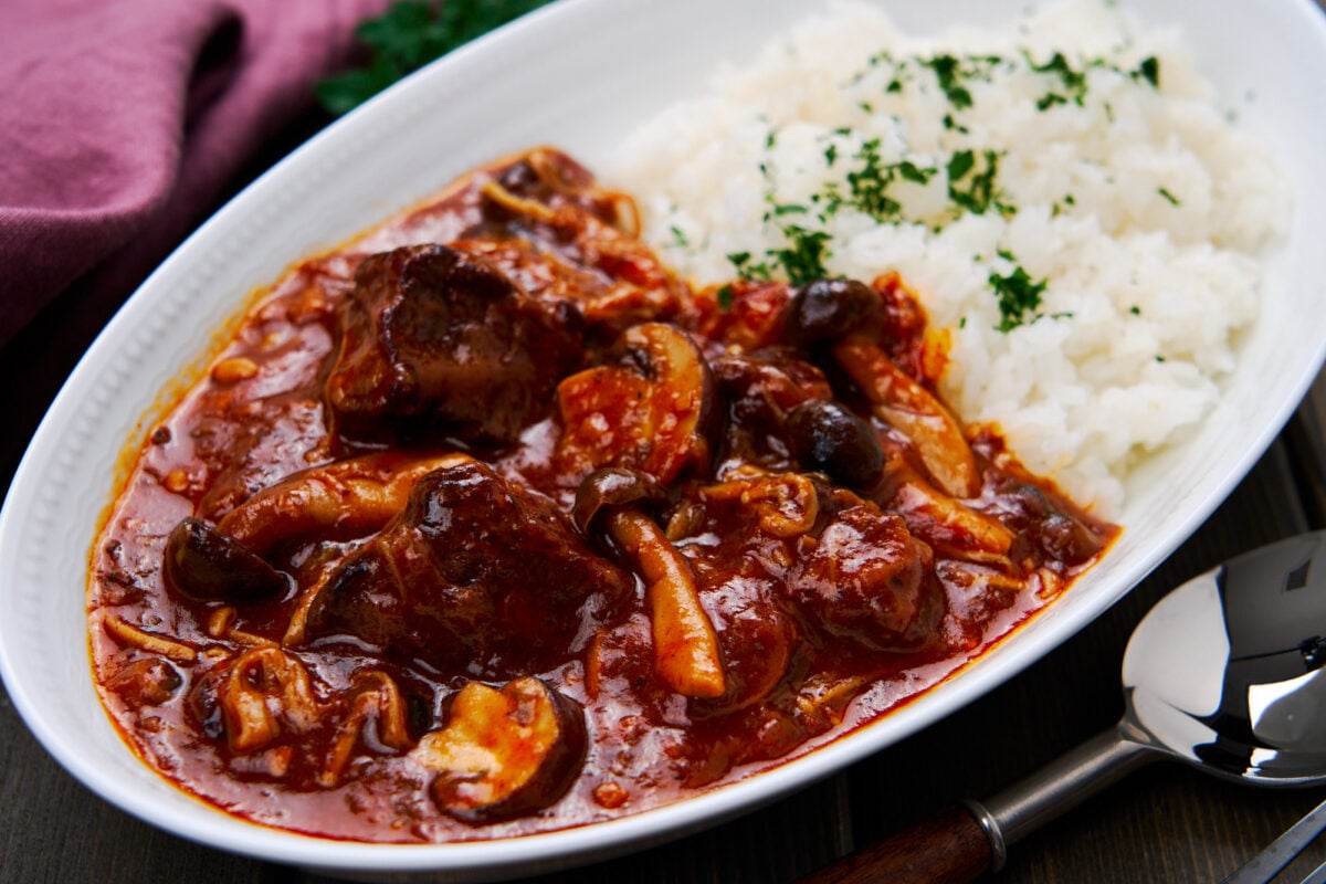 Fall apart tender beef stewed together with mushrooms and onions in a savory, sweet and tangy roux, Hayashi Rice is a popular Japanese stew.